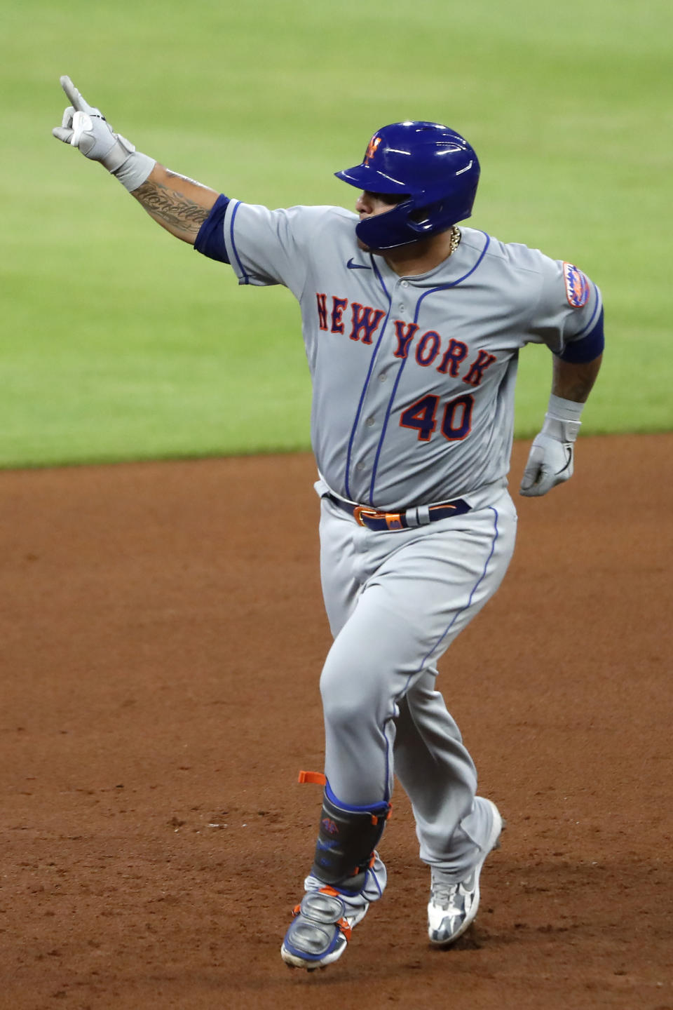 New York Mets catcher Wilson Ramos (40) gestures as he rounds the bases after hitting a two-run home run in the fifth inning of a baseball game against the Atlanta Braves Monday, Aug. 3, 2020, in Atlanta. (AP Photo/John Bazemore)