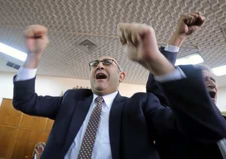 FILE PHOTO: Egyptian lawyer and ex-Presidential candidate Khaled Ali shout slogans inside the State Council courthouse after a ruling against the Egypt-Saudi border demarcation agreement, in Cairo, Egypt January 16, 2017. REUTERS/Mohamed Abd El Ghany