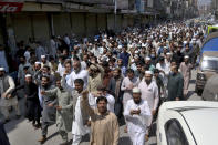 Traders hold a rally to condemn the security forces's crackdown against a banned Tehreek-e-Labaik Pakistan party, in Peshawar, Pakistan, Monday, April 19, 2021. An outlawed Pakistani Islamist political group freed 11 policemen almost a day after taking them hostage in the eastern city of Lahore amid violent clashes with security forces, the country's interior minister said Monday. (AP Photo/Muhammad Sajjad)