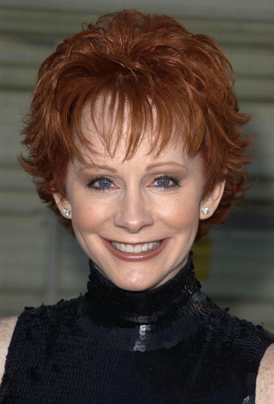 <p>Reba ditched her long curls in favor of a whimsical pixie cut that quickly caught on in 2001.</p>