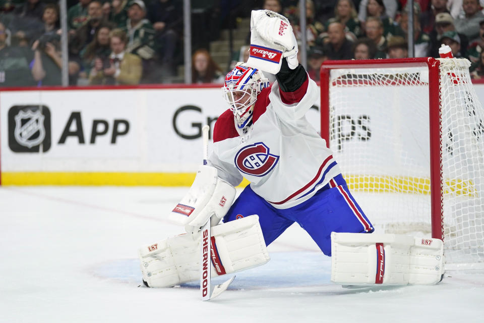 Montreal Canadiens goaltender Jake Allen (34) makes a stop during the first period of an NHL hockey game against the Minnesota Wild, Tuesday, Nov. 1, 2022, in St. Paul, Minn. (AP Photo/Abbie Parr)