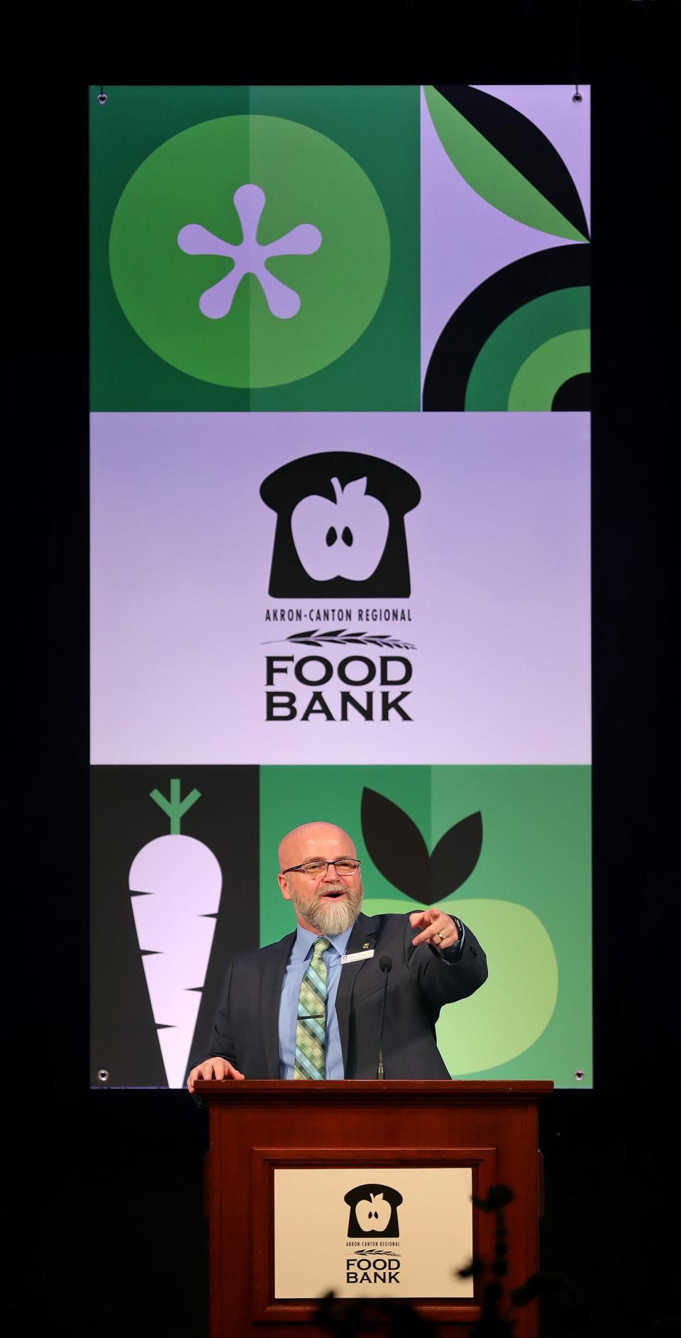 Akron-Canton Regional Foodbank President and CEO Dan Flowers addresses the audience during the Akron-Canton Regional Foodbank's Harvest for Hunger campaign kickoff breakfast Tuesday at the John S. Knight Center in Akron.