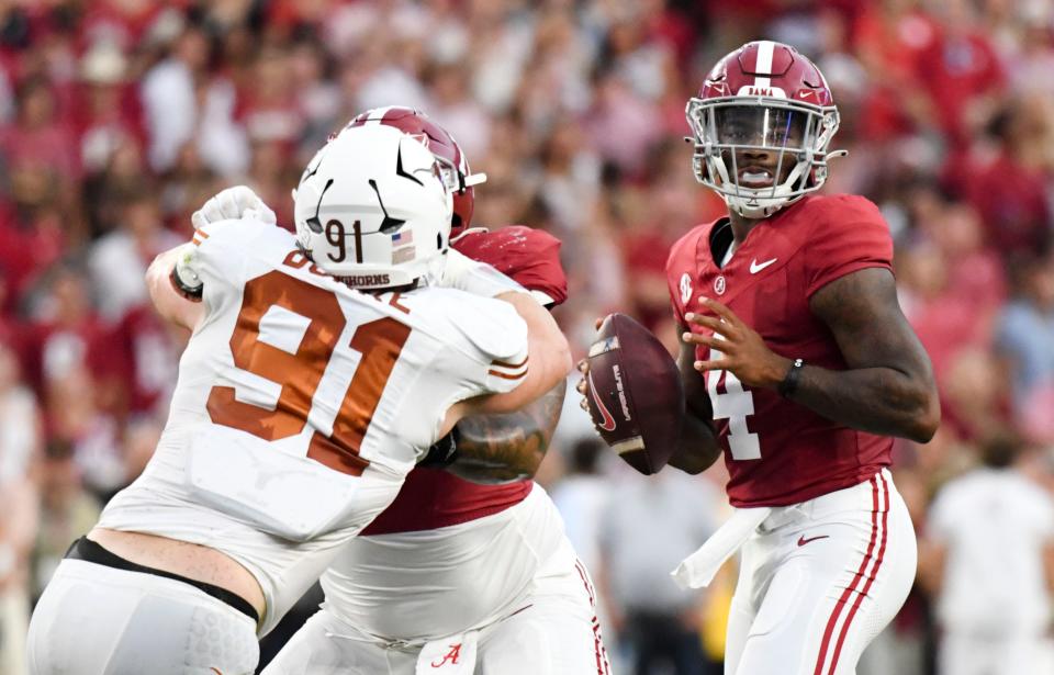 Jalen Milroe will return to the starting quarterback position Saturday against Ole Miss. In this Sept. 9, 2023 shot, Milroe (4) looks to pass behind blocking by Alabama Crimson Tide offensive lineman Darrian Dalcourt (71) against Texas Longhorns defensive end Ethan Burke (91) at Bryant-Denny Stadium. Mandatory Credit: Gary Cosby Jr.-USA TODAY Sports