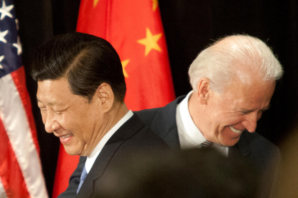 Image: Xi Jinping and Joe Biden, both then vice presidents, meet in February 2012 in Washington (Tim Rue / Corbis via Getty Images file)