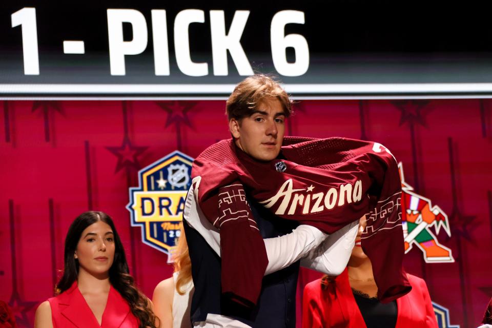 Dmitriy Simashev is selected by the Arizona Coyotes with the sixth overall pick during round one of the 2023 Upper Deck NHL Draft at Bridgestone Arena on June 28, 2023 in Nashville, Tennessee. (Photo by Bruce Bennett/Getty Images)