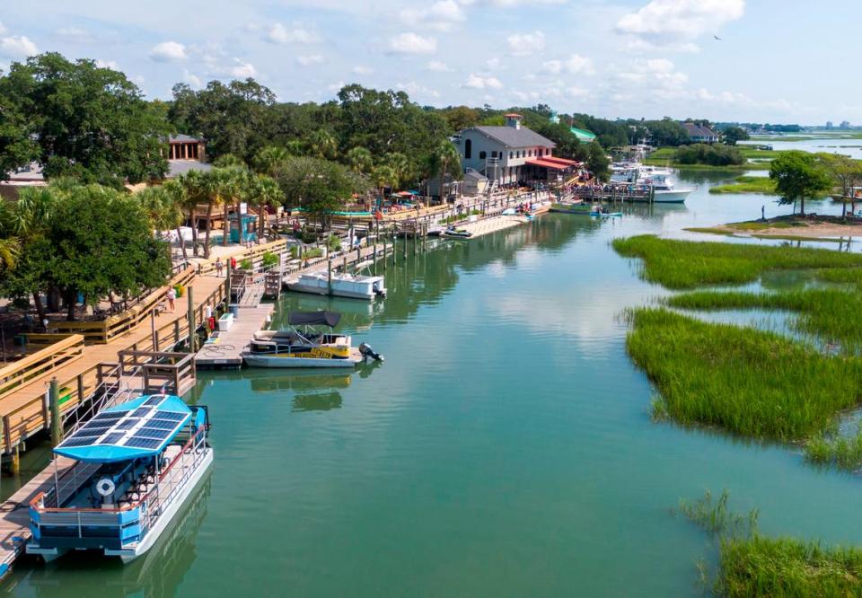 Murrells Inlet has seen rapid commercial development and tourism business along it’s Marsh Walk. Drone images of Murrells Inlet and Garden City Beach S.C. during high tide. Aug. 11, 2021.