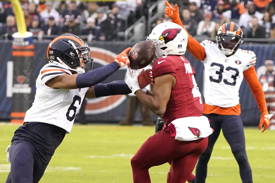 Chicago Bears cornerback Kyler Gordon (6) breaks up a pass intended for Arizona Cardinals wide receiver Rondale Moore during the first half of an NFL football game, Sunday, Dec. 24, 2023, in Chicago. (AP Photo/David Banks)