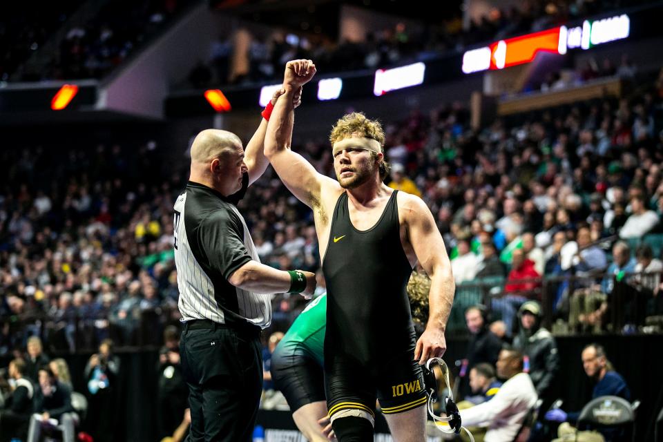 Iowa's Jacob Warner reacts after scoring a fall at 197 pounds during the third session of the NCAA Division I Wrestling Championships, Friday, March 17, 2023, at BOK Center in Tulsa, Okla.