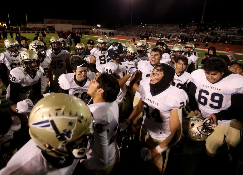 LOS ANGELES, CALIF. NOV. 18, 2022. The Birmingham High School football team celebrates after advancing in the playoffs by defeating Bannning in a City Section Open Division semifinal football game at Banning High School in Wilmington on Friday night, Nov. 18, 2022. (Luis Sinco / Los Angeles Times)