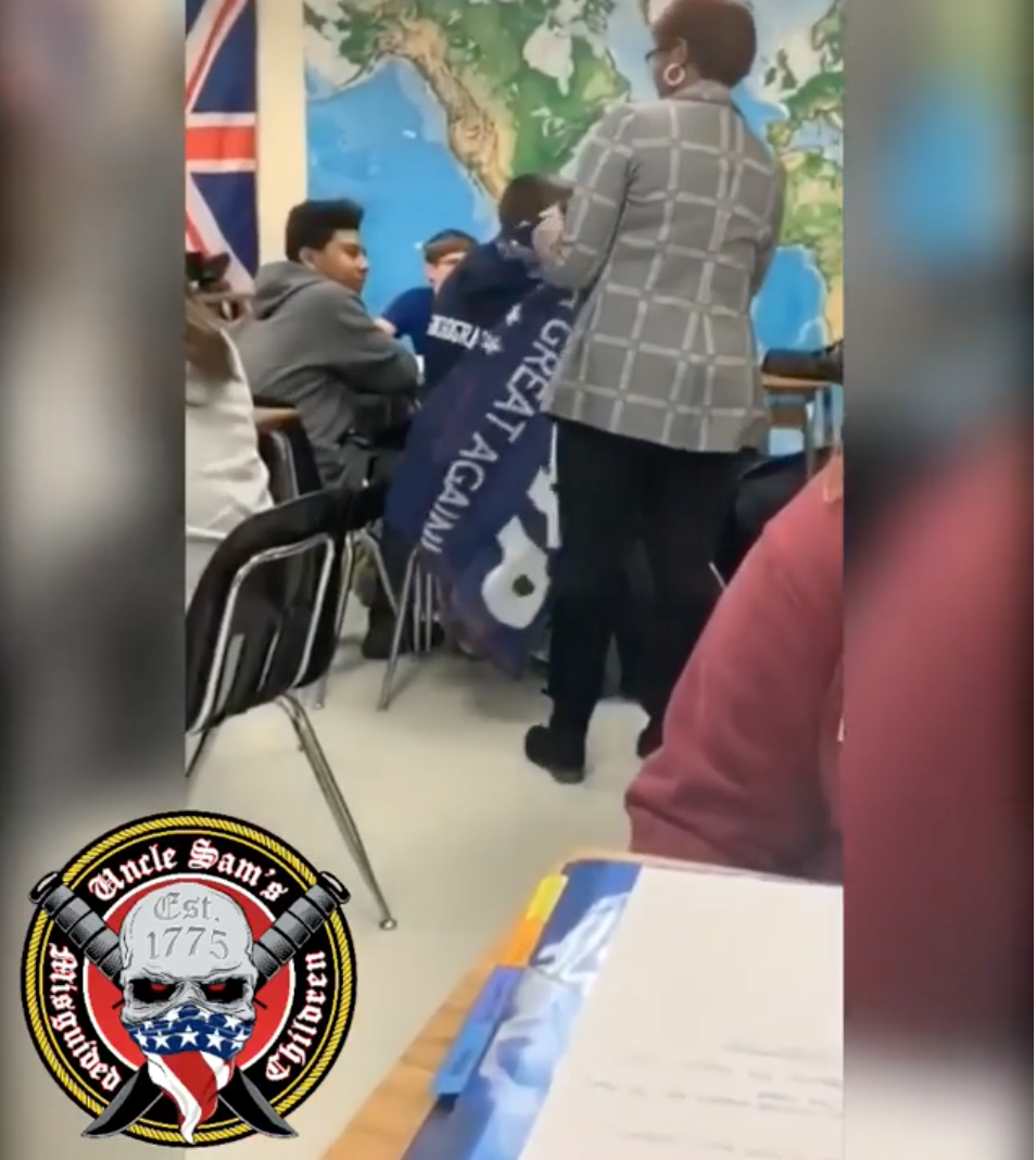A teaching assistant at Tabb High School in Yorktown, Va., appears to wrap a MAGA flag around the head of a student. (Photo: Uncle Sam’s Misguided Children via Instagram)