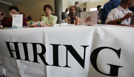 State Unemployment (FILE - In this Nov. 4, 2009 file photo, job recruiters wait at a booth at a holiday job fair at Skyline Coll