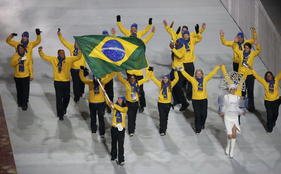 Brazil's flag-bearer Jaqueline Mourao leads her country's contingent during the opening ceremony of the 2014 Sochi Winter Olympics, February 7, 2014. REUTERS/Lucy Nicholson (RUSSIA - Tags: OLYMPICS SPORT)