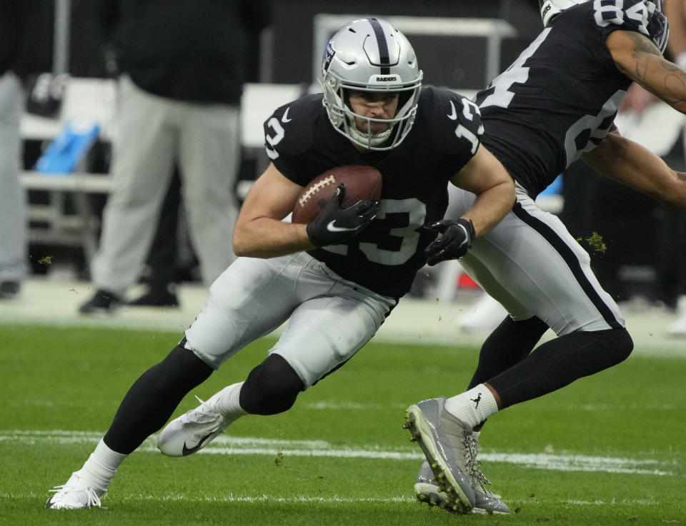 FILE - Las Vegas Raiders wide receiver Hunter Renfrow (13) runs the ball against the Kansas City Chiefs during the first half of an NFL football game Jan. 7, 2023, in Las Vegas. Since being drafted in the fifth round in 2019, Renfrow has asserted himself as one of the NFL's top receivers, but played in only 10 games last season because of injuries and posted career-low numbers. (AP Photo/Rick Scuteri, File)