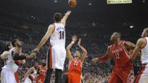 Houston Rockets' Chandler Parsons (25) shoots against Portland Trail Blazers' Joel Freeland (19) during the first half of game four of an NBA basketball first-round playoff series game in Portland, Ore., Sunday March 30, 2014. (AP Photo/Greg Wahl-Stephens)