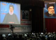 Lebanon's Hezbollah leader Sayyed Hassan Nasrallah is seen on a video screen as he addresses his supporters in Beirut, Lebanon November 10, 2017. REUTERS/Aziz Taher