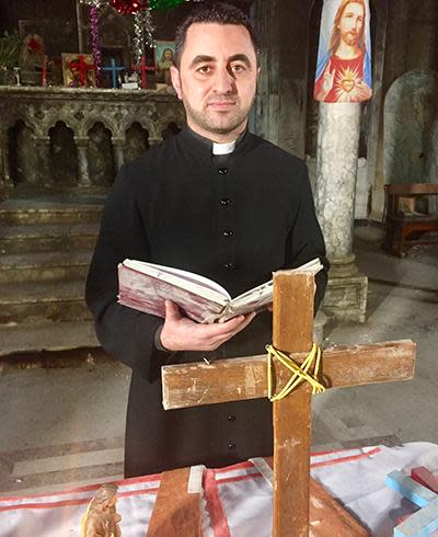 A Mosul priest preparing for a service. Most Christians fled Mosul after the arrival of Islamic State in June 2014