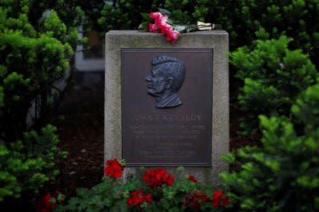 Roses lie on a marker outside the home where President John F. Kennedy was born 100 years ago on May 29, 1917, in Brookline, Massachusetts, U.S., May 29, 2017.   REUTERS/Brian Snyder