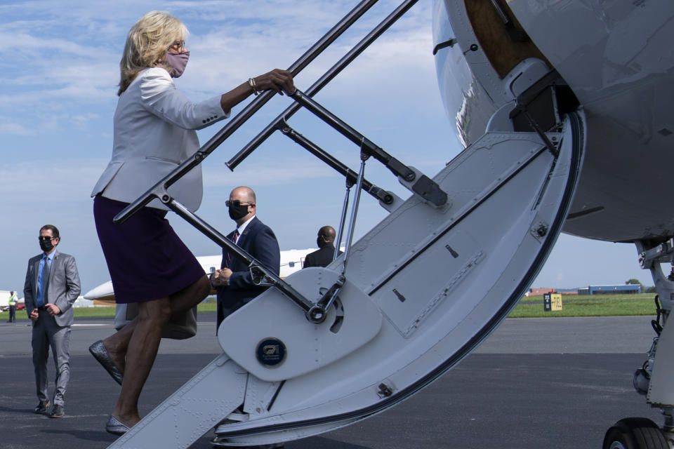 FILE - In this Sept. 3, 2020, file photo Jill Biden, wife of Democratic presidential candidate former Vice President Joe Biden, boards a plane at New Castle Airport in New Castle, Del., en route to participates in a community meeting in Kenosha, Wis. If Joe Biden wins the election, Jill has vowed his administration will make listening to teachers' concerns a priority. (AP Photo/Carolyn Kaster, File)