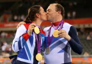 Husband and wife, Sarah and Barney Storey pose with the medals they have won in the Track Cycling events on day 4 of the London 2012 Paralympic Games at Velodrome on September 2, 2012 in London, England. (Photo by Bryn Lennon/Getty Images)