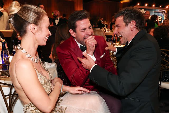 <p>Christopher Polk/Golden Globes 2024/Golden Globes 2024 via Getty</p> Emily Blunt, John Krasinski and Bradley Cooper