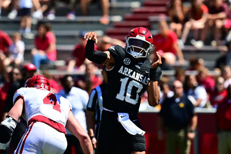 Taylen Green (10) fires a pass under pressure during the Arkansas football spring game Saturday, April 13, 2024.