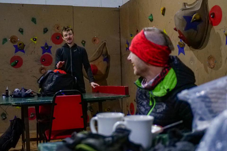 <span class="caption">Jack Scott (left) and Damian Hall during one of their brief stops during the Spine Race. Photo: Mick Kenyon. </span>