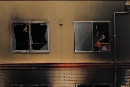 A man prays for victims of the torched Kyoto Animation building in Kyoto