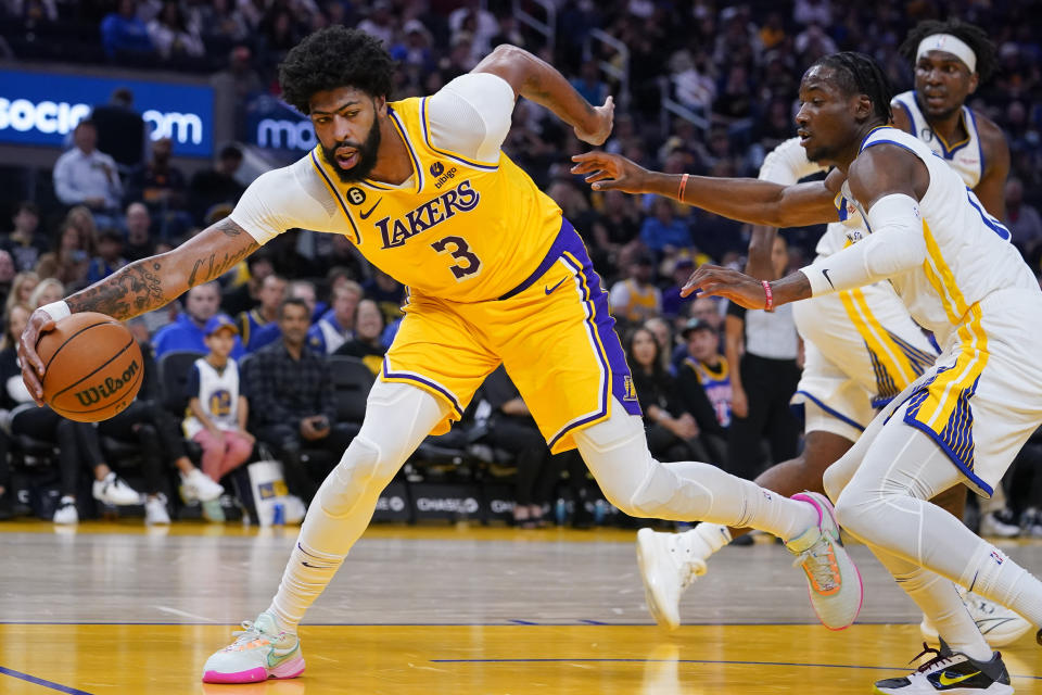 Los Angeles Lakers forward Anthony Davis (3) keeps the ball inbound against the Golden State Warriors during the first half of a basketball game in San Francisco, Sunday, Oct. 9, 2022. (AP Photo/Godofredo A. Vásquez)