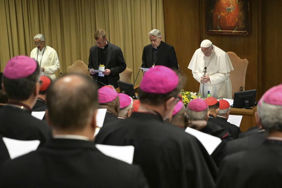 Pope Francis, right, prays at the opening of a sex abuse prevention summit, at the Vatican, Thursday, Feb. 21, 2019. The gathering of church leaders from around the globe is taking place amid intense scrutiny of the Catholic Church's record after new allegations of abuse and cover-up last year sparked a credibility crisis for the hierarchy. (Vincenzo Pinto/Pool Photo via AP)