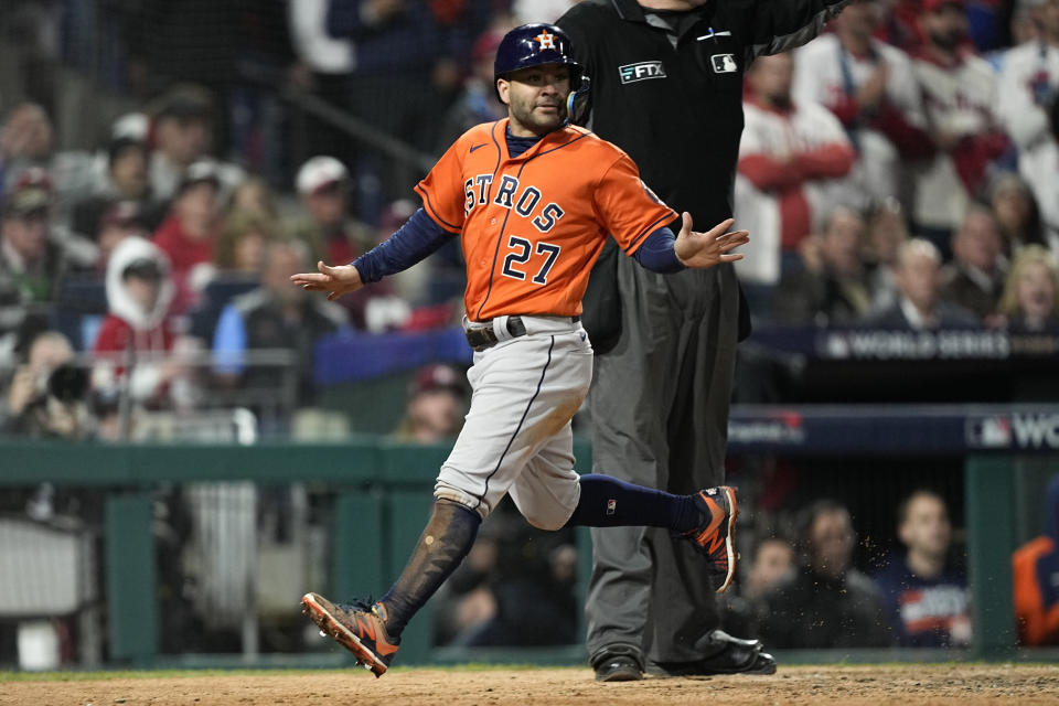 Houston Astros' Jose Altuve celebrates after scoring on a ball hit by Yordan Alvarez during the eighth inning in Game 5 of baseball's World Series between the Houston Astros and the Philadelphia Phillies on Thursday, Nov. 3, 2022, in Philadelphia. (AP Photo/David J. Phillip)