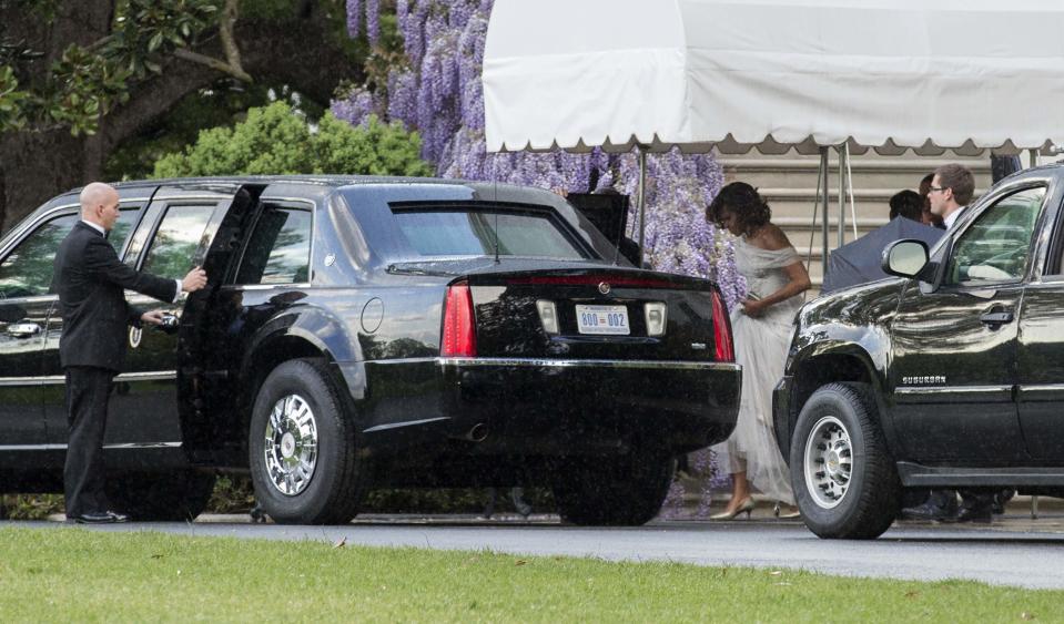 U.S. First Lady Michelle Obama steps into the limousine as President Barack Obama and herself depart for the White House Correspondents' Association Dinner from the White House in Washington May 3, 2014. (REUTERS/Joshua Roberts)