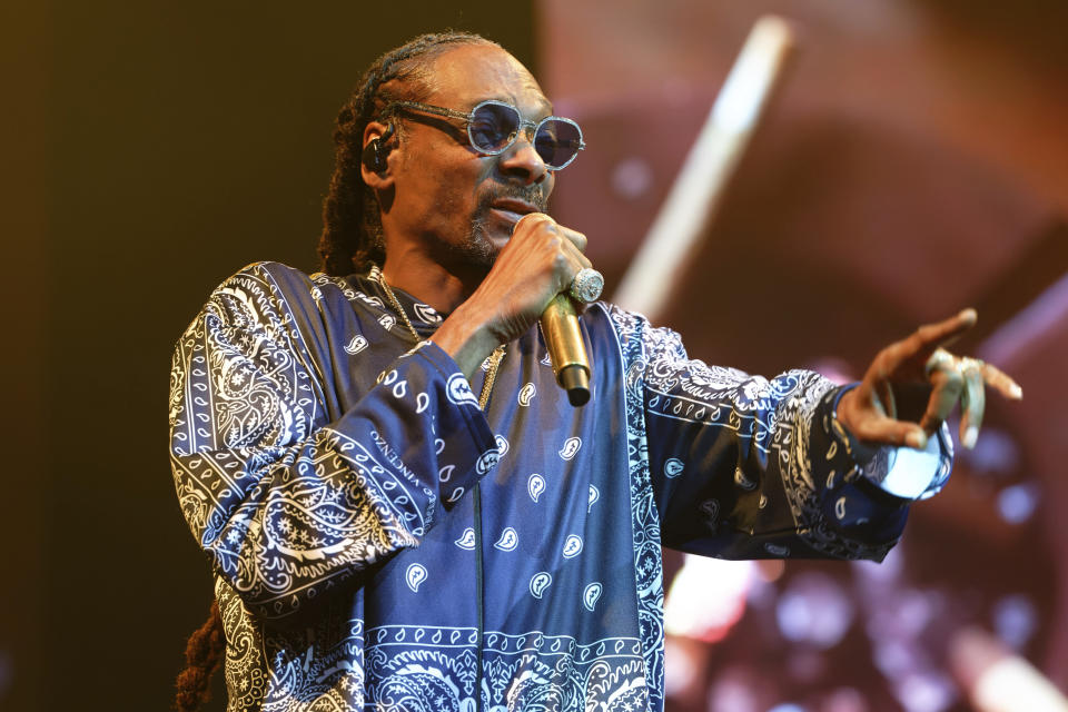 Rapper Snoop Dogg performs during a concert at Lanxess Arena, Thursday, Sept. 21, 2023, in Cologne, Germany. (Henning Kaiser/dpa via AP)