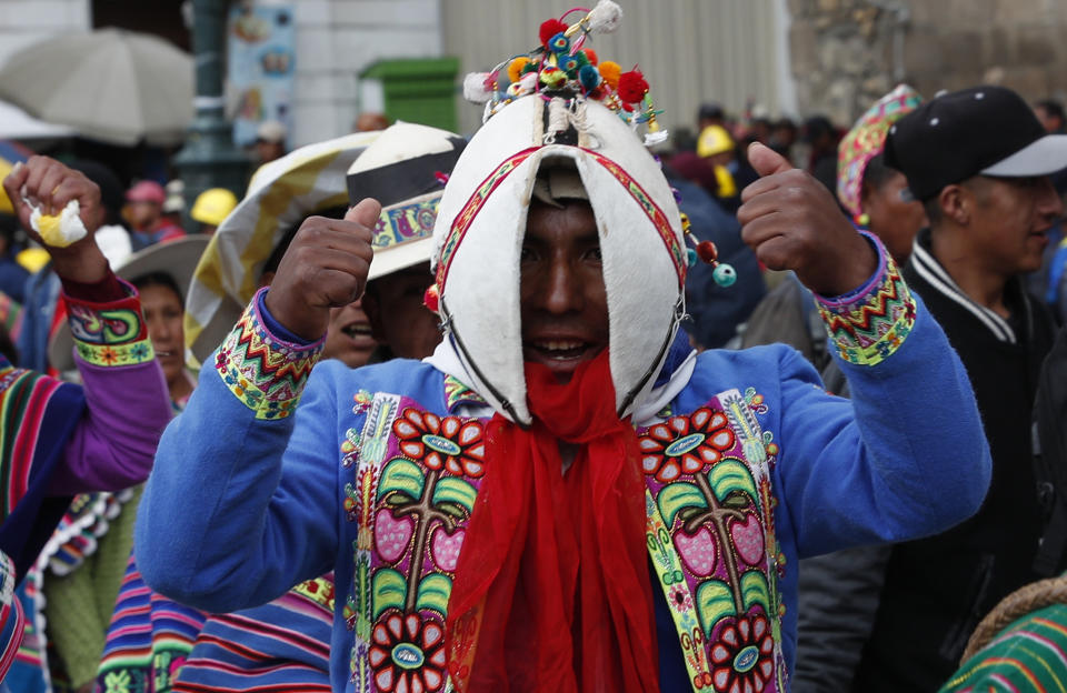 Quechua indigenous supporters of Bolivian President Evo Morales march in defense of his apparent reelection in La Paz, Bolivia, Tuesday, Nov. 5, 2019. Backers of Bolivia's president blocked the arrival of an opposition leader Luis Fernando Camacho to the capital of La Paz on Tuesday and the government flew him back to his home city amid protests over Morales' apparent reelection. (AP Photo/Juan Karita)