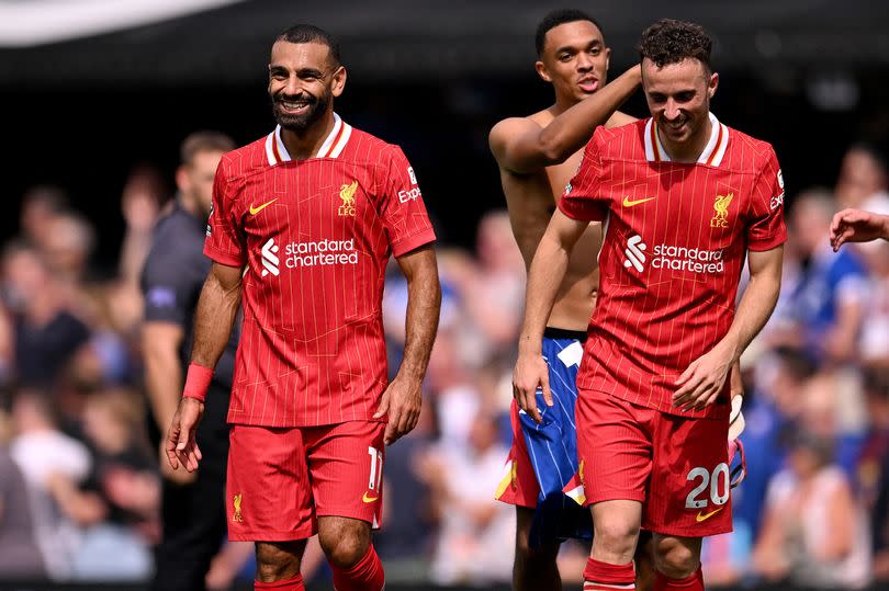 IPSWICH, ENGLAND - AUGUST 17: (THE SUN OUT, THE SUN ON SUNDAY OUT) Mohamed Salah, Trent Alexander-Arnold and Diogo Jota of Liverpool at the end of the Premier League match between Ipswich Town FC and Liverpool FC at Portman Road on August 17, 2024 in Ipswich, England. (Photo by Andrew Powell/Liverpool FC via Getty Images)