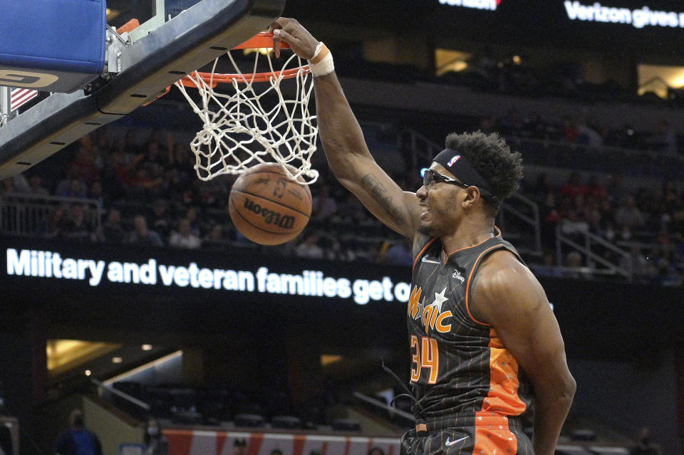 Orlando Magic center Wendell Carter Jr. (34) dunks during the first half of an NBA basketball game against the Chicago Bulls, Friday, Nov. 26, 2021, in Orlando, Fla. (AP Photo/Phelan M. Ebenhack)