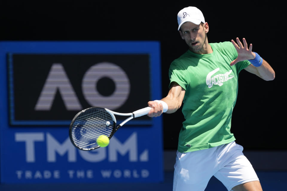 FILE - Defending men's champion Serbia's Novak Djokovic practices on Margaret Court Arena ahead of the Australian Open tennis championship in Melbourne, Australia, on Jan. 13, 2022. Tennis star Djokovic faces deportation again after the Australian government revoked his visa for a second time. Immigration Minister Alex Hawke said Friday, Jan. 14, he used his ministerial discretion to revoke the 34-year-old Serb’s visa on public interest grounds three days before the Australian Open is to begin.(AP Photo/Mark Baker, File)