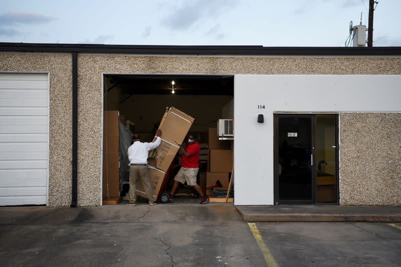 The Wider Image: 'I just ask God to help me': Texas funeral home crushed by death as U.S. COVID toll nears 500,000