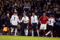 England's David Beckham (l) shakes hands with his replacement Scott Parker (c) as Jermaine Jenas (l) also replaces Wayne Rooney (far r) (Photo by Mike Egerton/EMPICS via Getty Images)