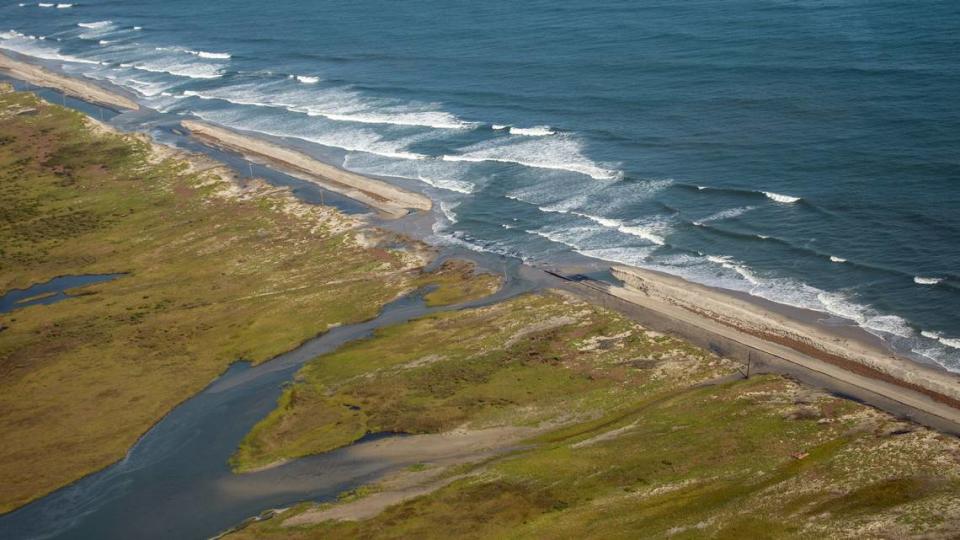 Ocean waves flow over N.C. 12 on the Outer Banks Saturday, Sept. 7, 2019 after Hurricane Dorian washed over several sections of the highway.