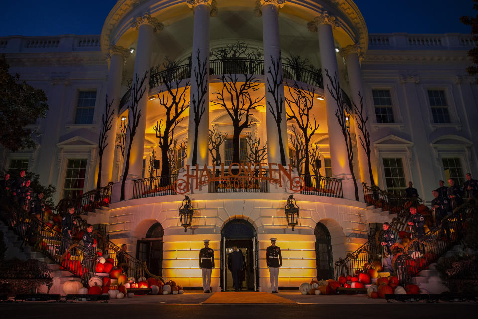 President Donald Trump and first lady Melania Trump depart after giving candy to children during a Halloween trick-or-treat event on the South Lawn of the White House which is decorated for Halloween, Monday, Oct. 28, 2019, in Washington. (AP Photo/Alex Brandon)