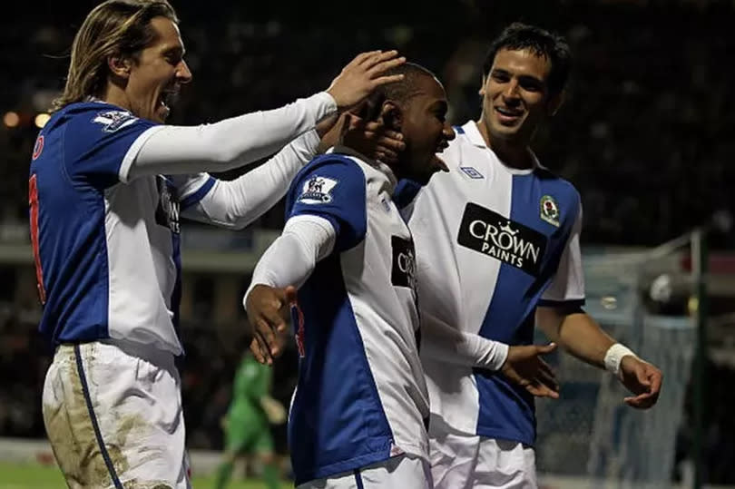 Junior Hoilett (centre) of Blackburn Rovers celebrates with his team mates Roque Santa Cruz and Michel Salgado (left)