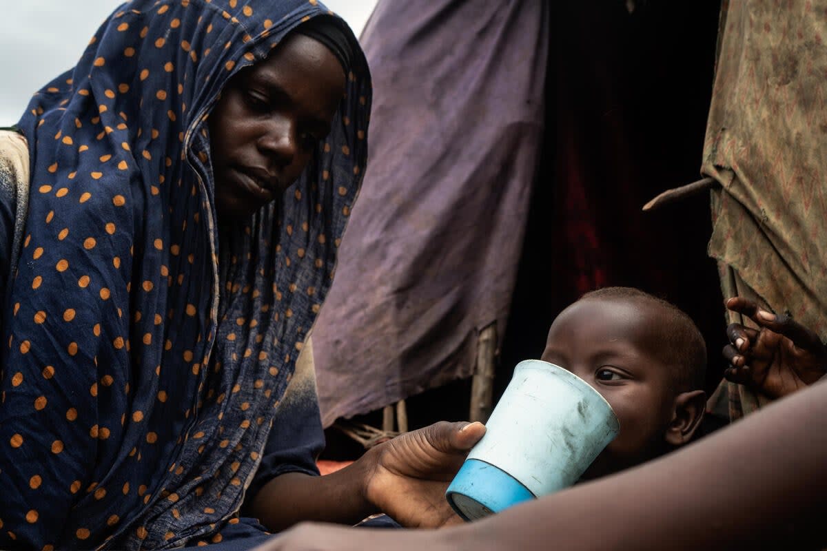 Sokorey* used to have livestock, which helped to feed her family, but they died due to the drought - so she now makes tea with some sugar in it as their main meal of the day (Fredrik Lerneryd/Save the Children)