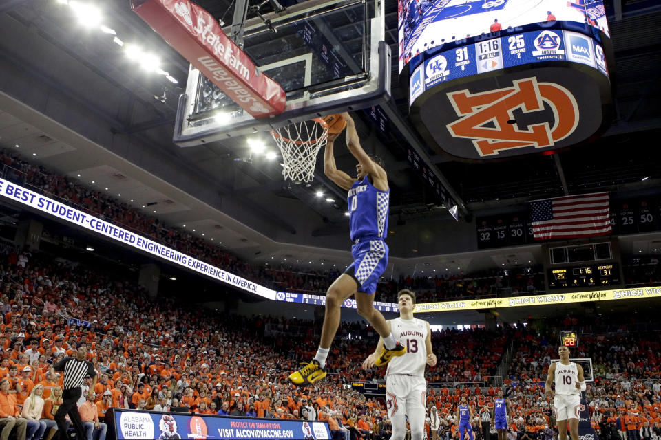 Kentucky forward Jacob Toppin (0) dunks the ball against Auburn during the first half of an NCAA college basketball game Saturday, Jan. 22, 2022, in Auburn, Ala. (AP Photo/Butch Dill)