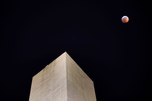 Mandatory Credit: Photo by JIM LO SCALZO/EPA-EFE/REX/Shutterstock (10069477c) The moon turns red during the so-called 'super blood wolf moon' lunar eclipse above the Washington Monument in Washington, DC, USA, 20 January 2019. Bitterly cold temperatures hovering just above zero degrees Fahrenheit did not stop DC residents from watching the only total lunar eclipse of the year. Super blood wolf moon lunar eclipse in Washington, DC, USA - 21 Jan 2019