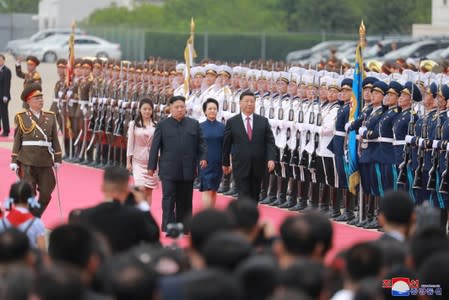 Chinese President Xi Jinping and North Korean leader Kim Jong Un meet in Pyongyang