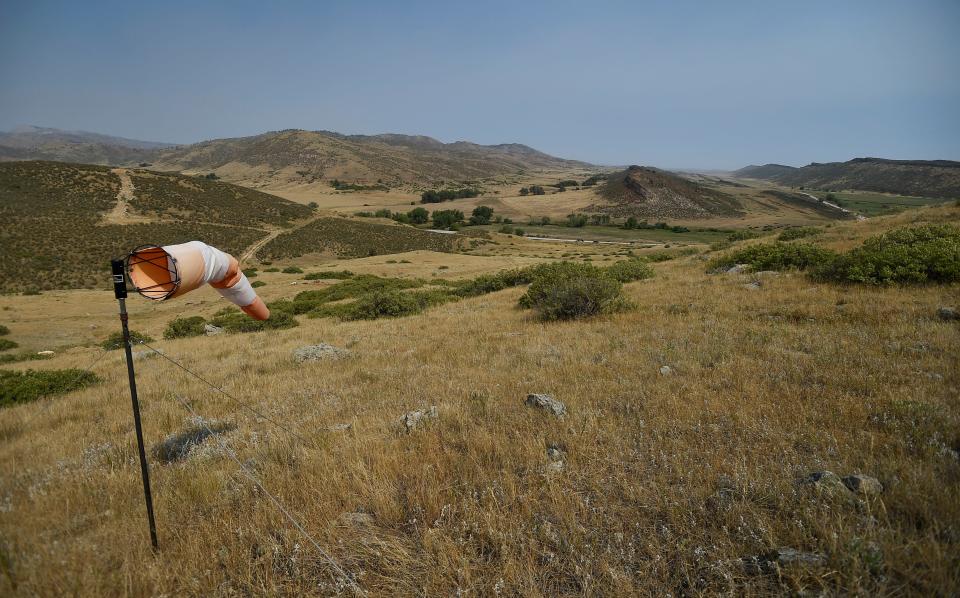 A windsock indicates wind direction in front of the valley where Glade Reservoir would be built northwest of Fort Collins on Aug. 14, 2020.