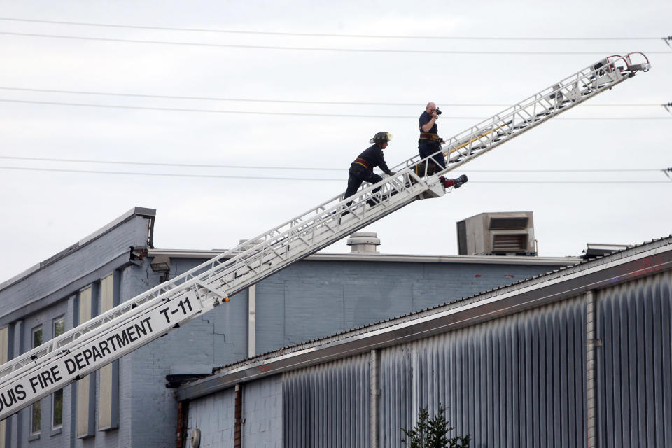 Crews work at the scene after a boiler exploded at a roof of a St. Louis box company and flew before crashing through the roof of a nearby laundry business, Monday, April 3, 2017. Authorities said several people were killed as a result of the explosion. (Laurie Skrivan/St. Louis Post-Dispatch via AP)