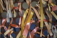 Orange ribbons decorate a memorial site for the victims of the August 2019 mass shooting in El Paso, Texas, Wednesday, Feb. 8, 2023. Patrick Crusius, the defendant in the deaths of 23 people at an El Paso Walmart is expected to plead guilty during a re-arraignment hearing in federal court. (AP Photo/Andrés Leighton)