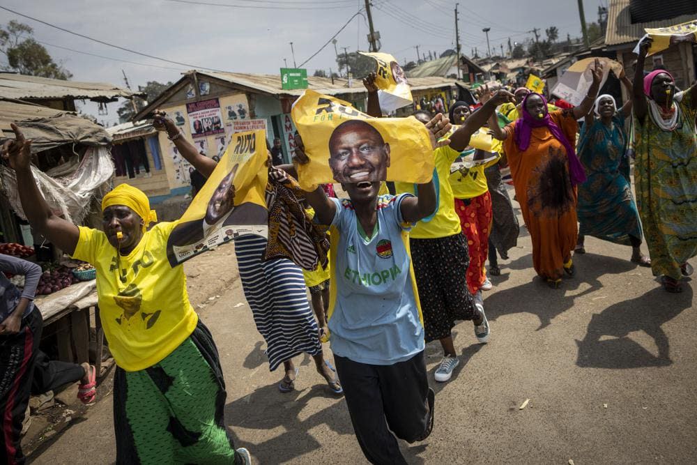 Supporters of William Ruto hold campaign posters of him as they celebrate and march along a street in the Kibera neighborhood of Nairobi, Kenya Monday, Sept. 5, 2022. Kenya’s Supreme Court has unanimously rejected challenges to the official results of the presidential election and upheld Deputy President William Ruto’s narrow win in East Africa’s most stable democracy. Ruto is expected to be sworn in on Sept. 13. (AP Photo/Ben Curtis)