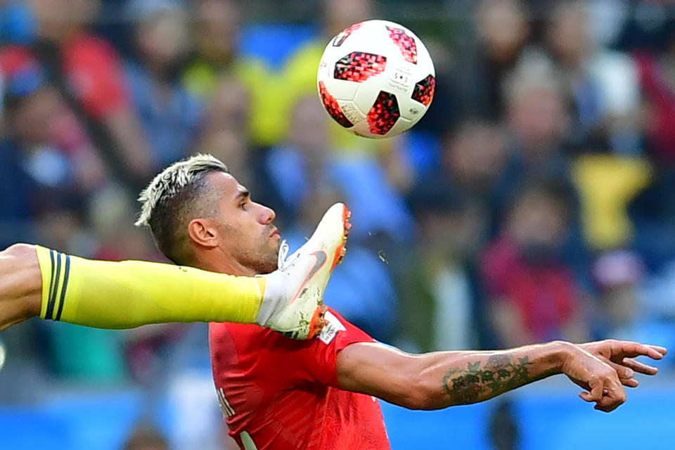 <p>Sweden’s forward Marcus Berg (L) fights for the ball with Switzerland’s midfielder Valon Behrami during the Russia 2018 World Cup round of 16 football match between Sweden and Switzerland at the Saint Petersburg Stadium in Saint Petersburg on July 3, 2018. (Photo by Giuseppe CACACE / AFP) </p>